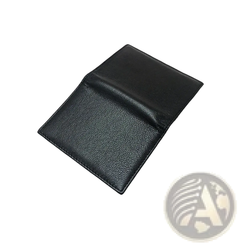 Minimalist leather card holder slim wallet in black with textured surface and precise stitching along the edges