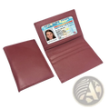 Minimalist leather card holder slim wallet in maroon with multiple card slots and clear id window holding new york license