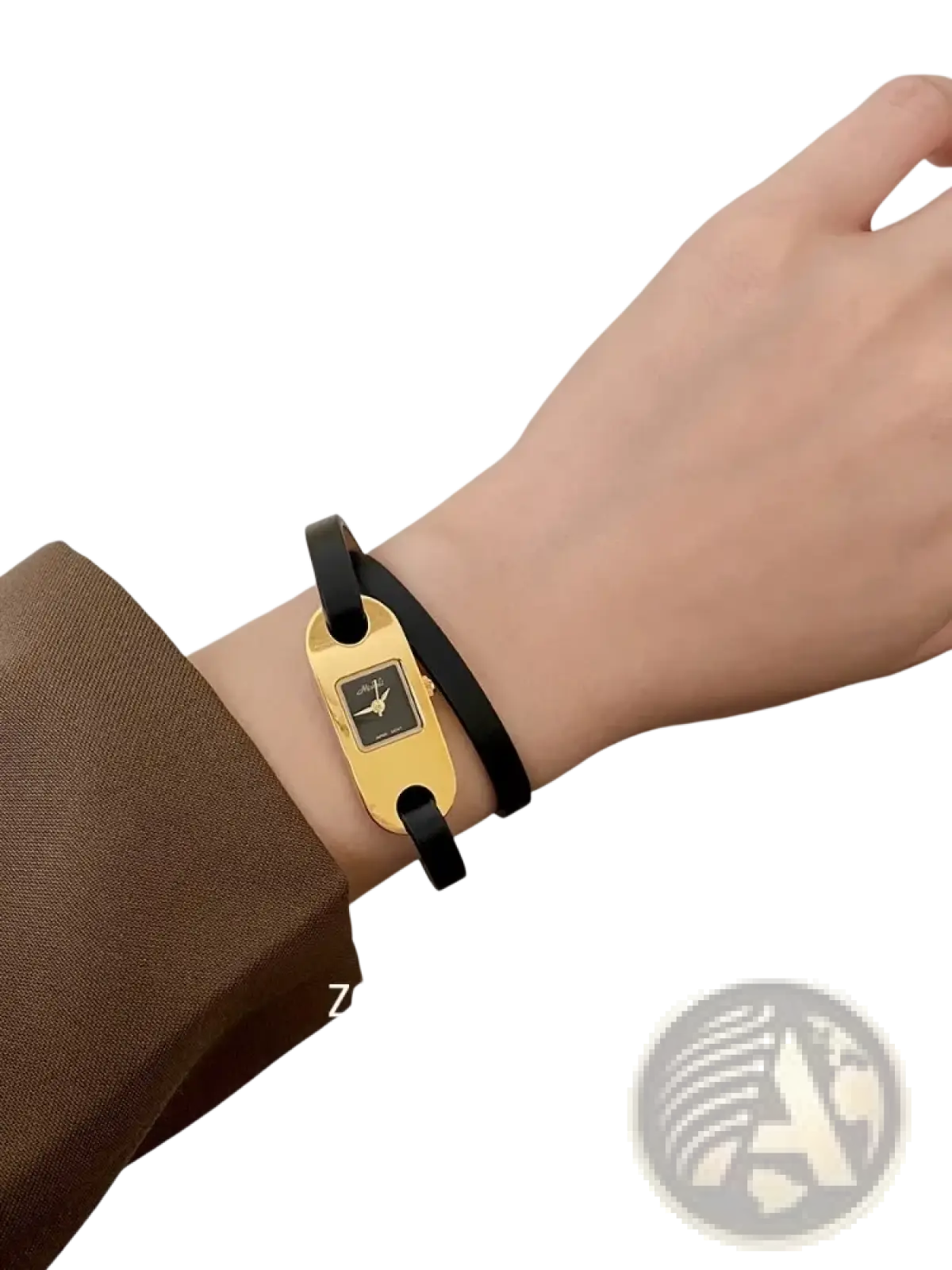 Minimalist leather watch for women with a gold-toned rectangular case black face and sleek black leather straps worn on wrist