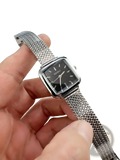 Minimalist square quartz watch for women with silver mesh bracelet and black face with white hour markers