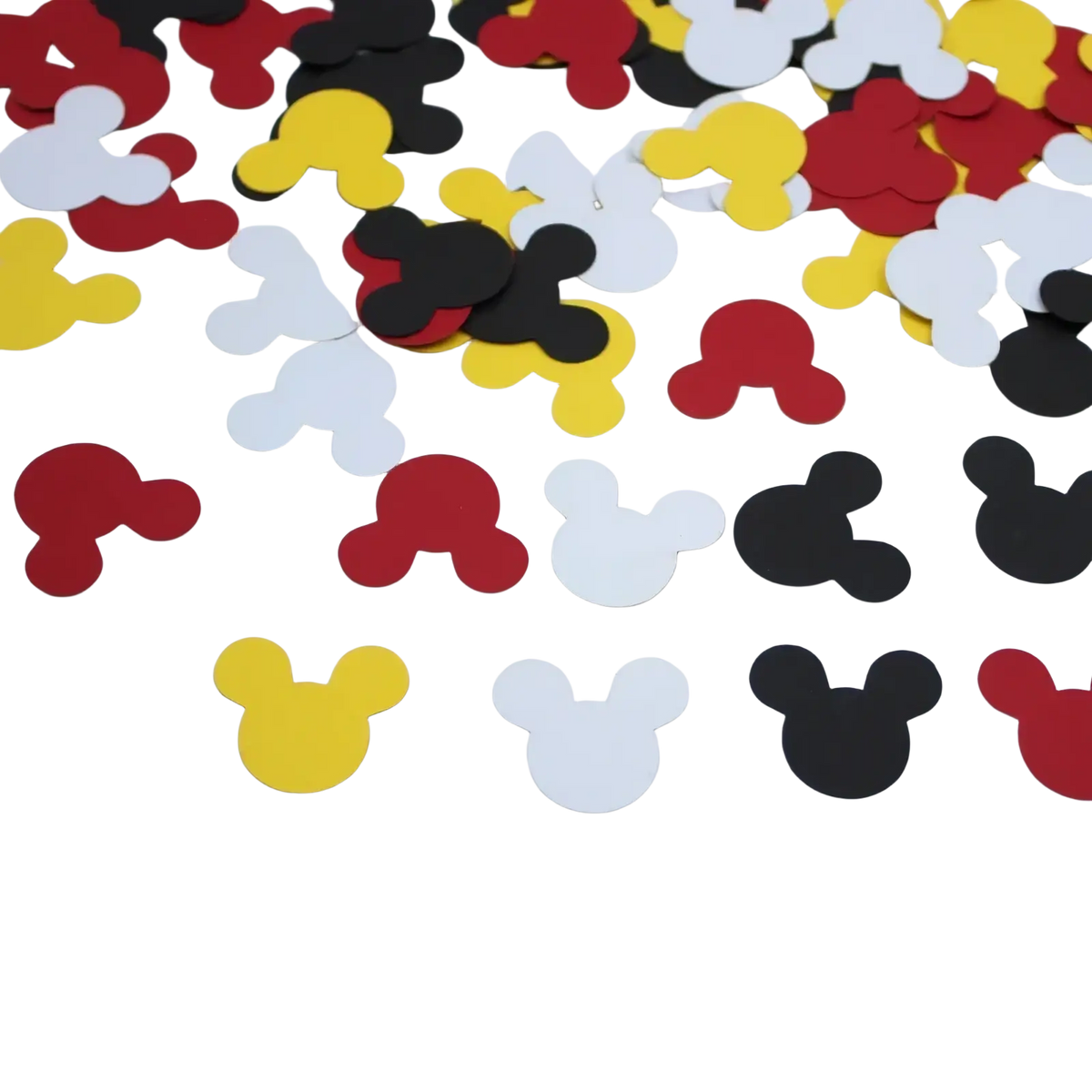 Minnie mouse baby shower confetti table decor featuring red yellow black and white mickey mouse head shapes