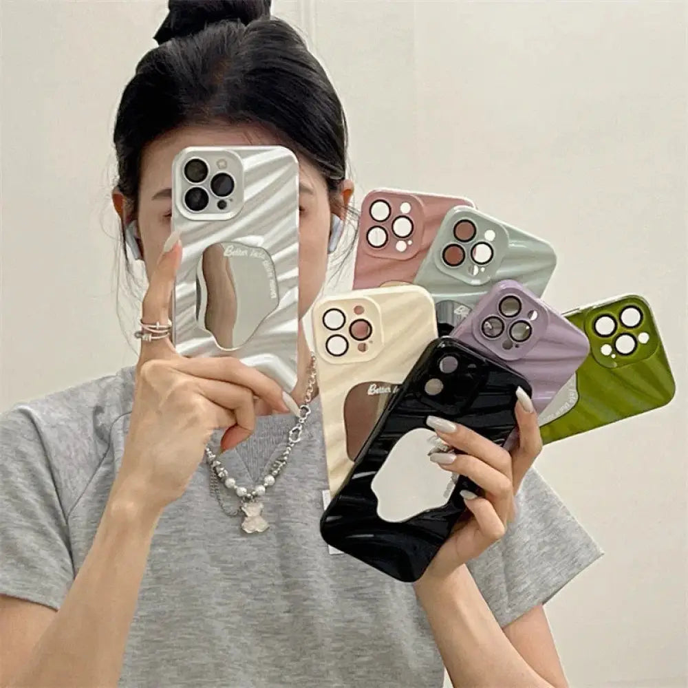 A collection of glossy mirrored mirror water ripple reflective cases for iphone 14 pro max in pastel and solid colors