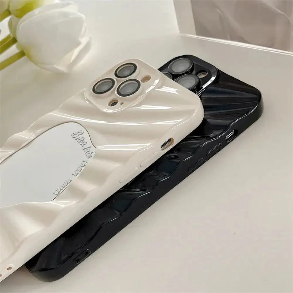 Back side of shiny glossy cream and black mirror water ripple reflective cases with wavy texture for iphone 14 pro max