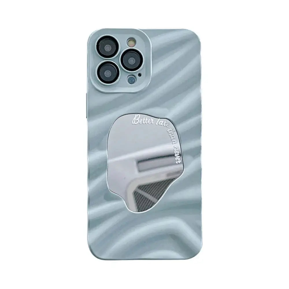 Back side of a sleek light blue mirror water ripple reflective case for iphone 14 pro max with wavy texture and oval mirror inset