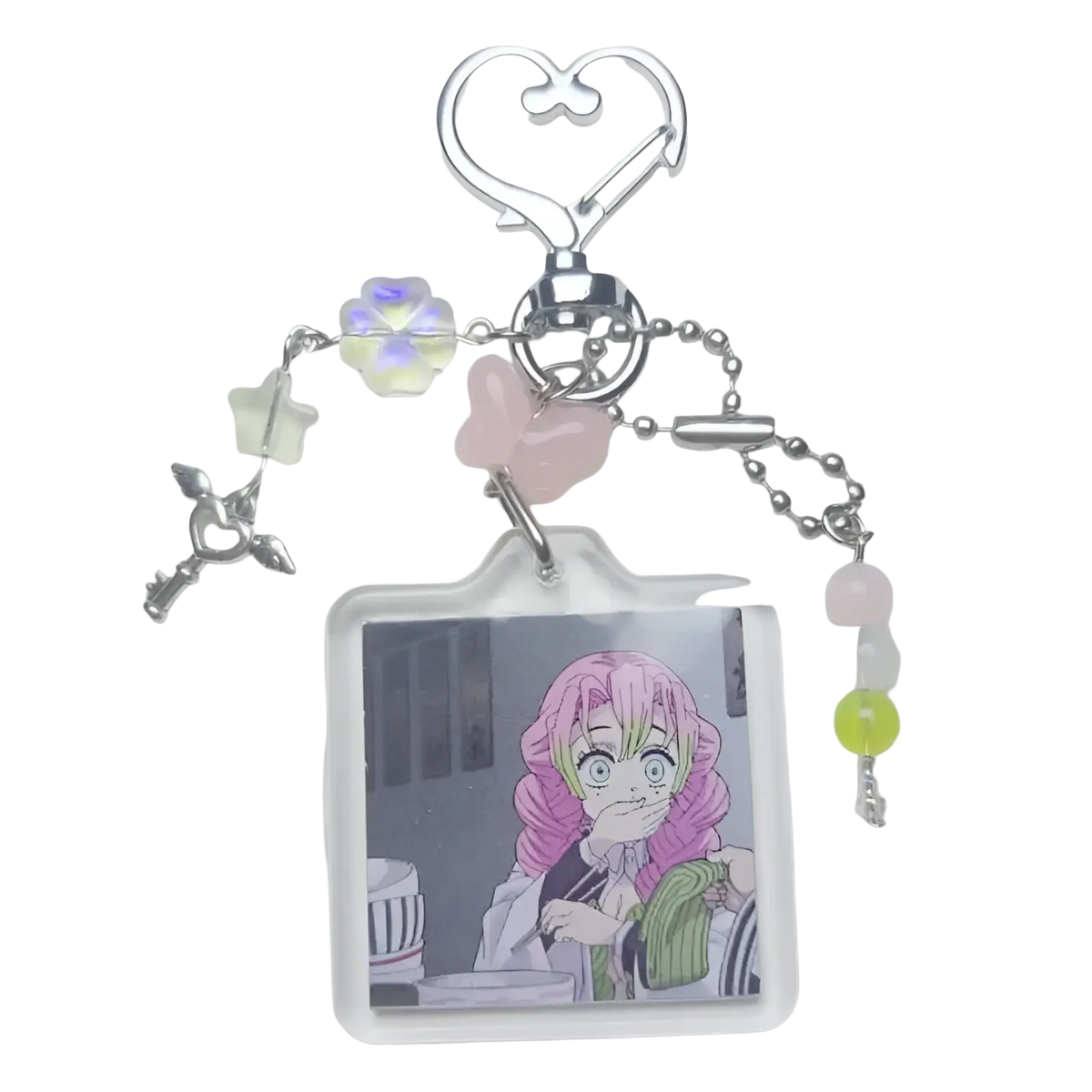 A clear acrylic mitsuri kanroji anime keychain with pink hair image and pastel beaded heart clip charms