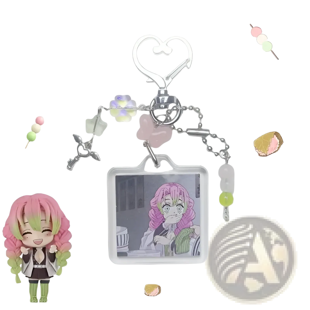 A clear rectangular mitsuri kanroji anime keychain with pink and green hair image, silver charms, and pastel beads