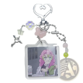 A clear acrylic mitsuri kanroji anime keychain with pink hair image and pastel beaded heart clip charms