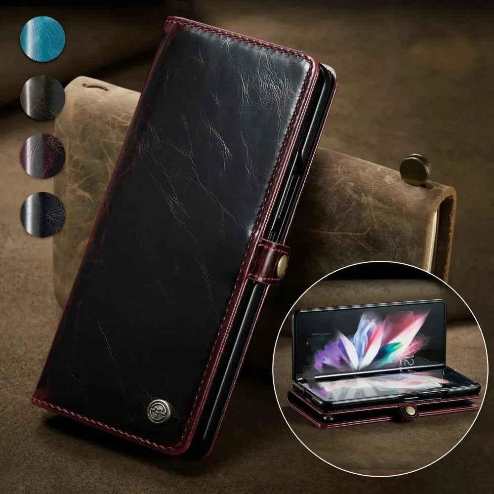 Black leather ergonomic anti fatigue game console handle grip with marbled texture burgundy stitching and gold snap closure