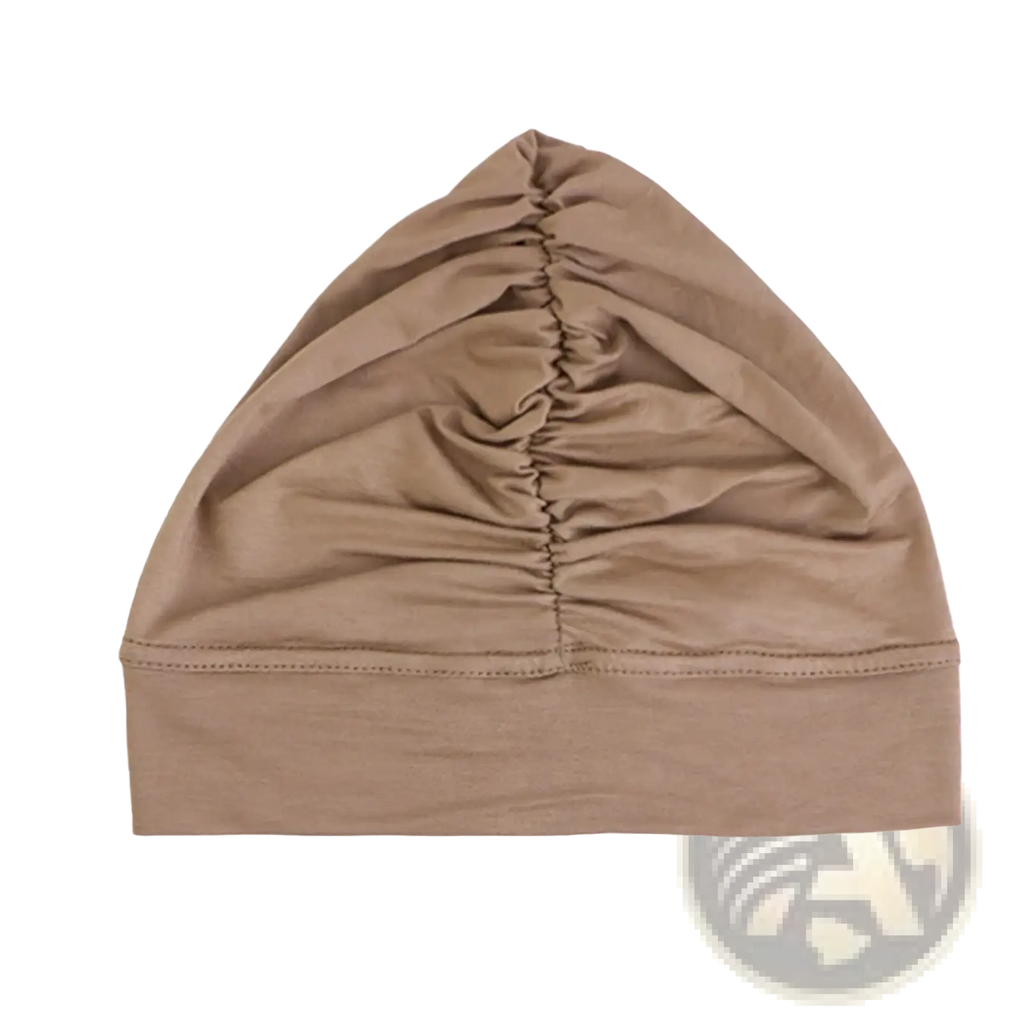 Beige modal cotton turban headwrap chemo cap with stretchy knit, gathered ruched front, and ribbed brim