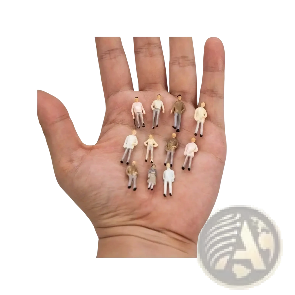 A collection of colorful miniature plastic model train sitting passengers painted dolls on an open palm