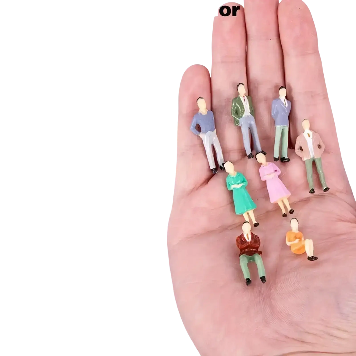 A collection of painted model train sitting passengers miniature figures in various outfits and poses for model train use
