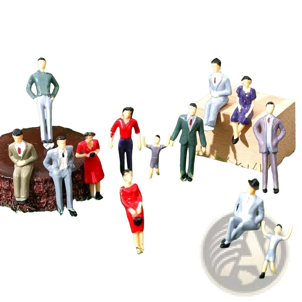 A collection of painted miniature plastic model train sitting passengers in formal and casual attire on artificial grass