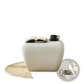 Modern accent coffee table featuring a cream-colored textured ottoman with a rounded square shape