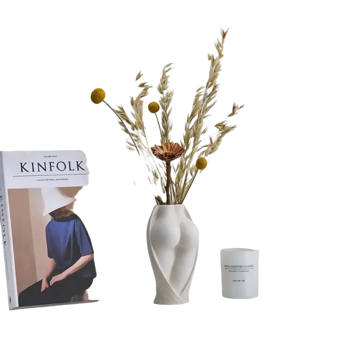 Modern ceramic torso vase in white with a sculpted curving form holding dried botanicals for tabletop decor