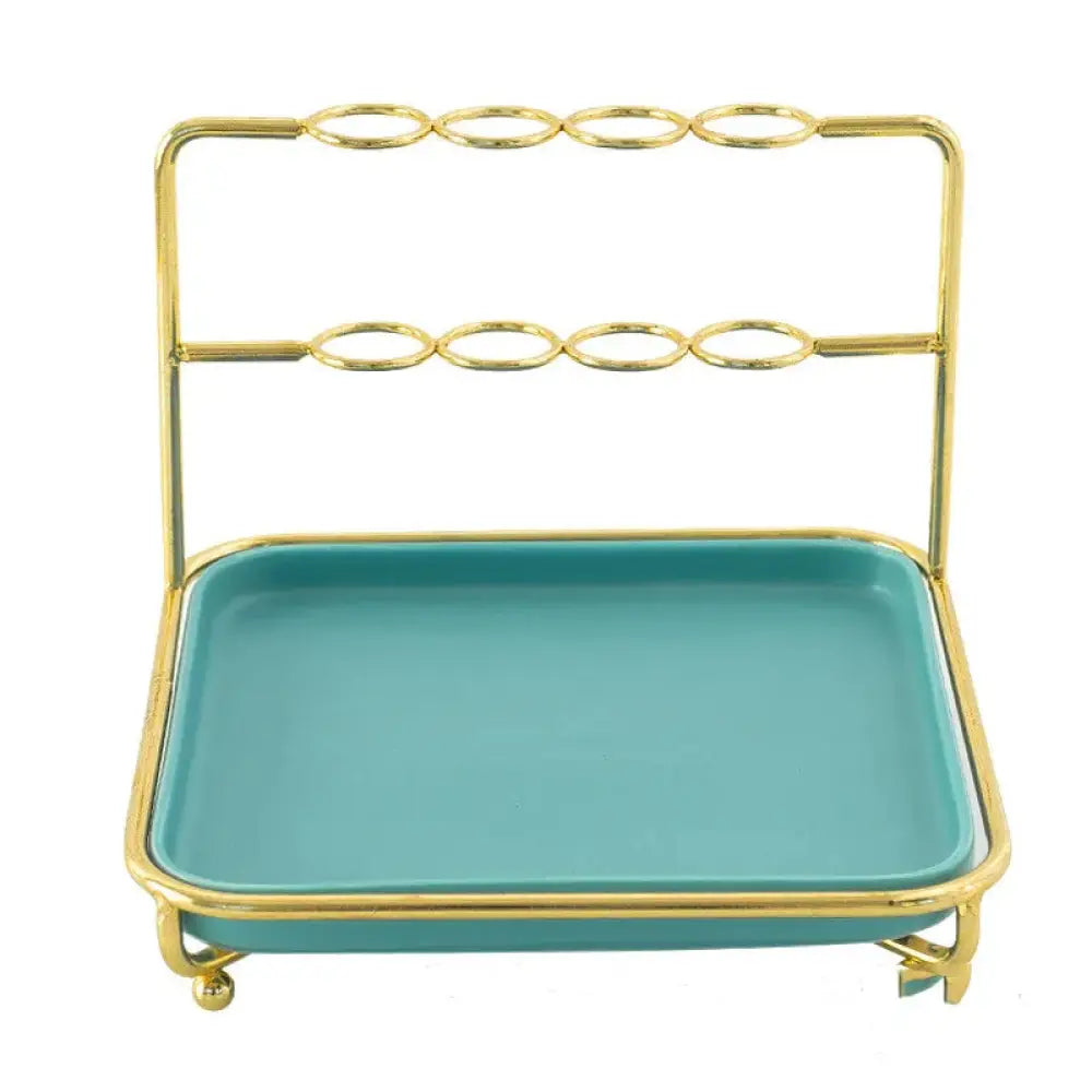 Modern gold and ceramic vanity cosmetics organizer with gold metal frame and teal ceramic tray base for makeup storage