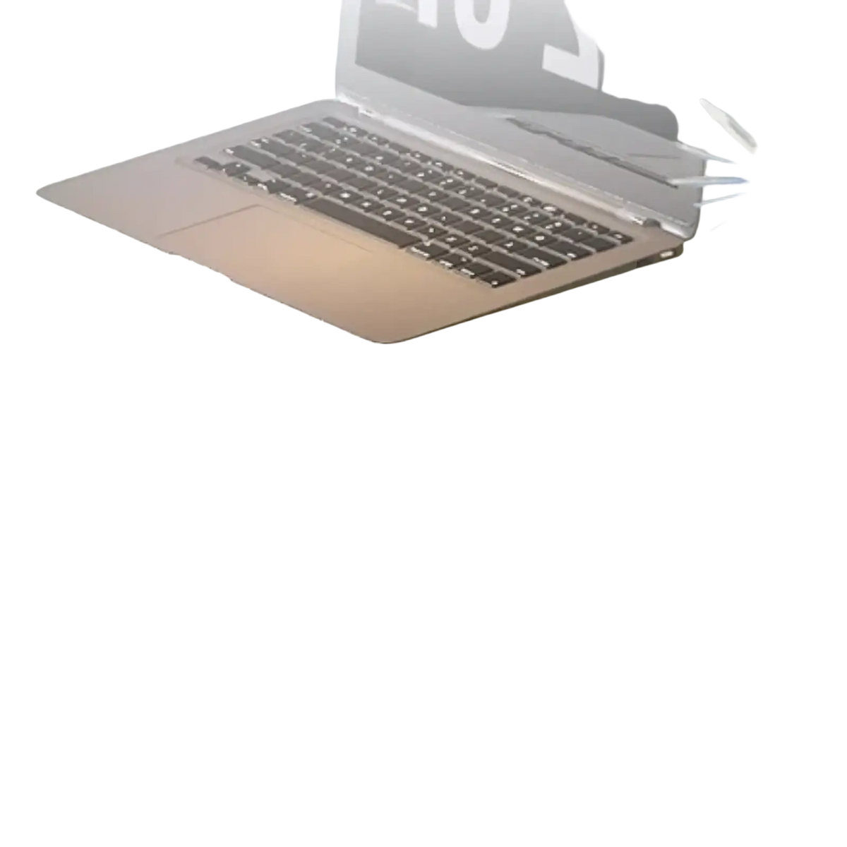 Silver laptop with black keyboard and trackpad on a reflective glass office desk with storage shelves