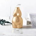 Golden smooth-surfaced ceramic vase shaped like a stylized female torso for modern minimalist decor