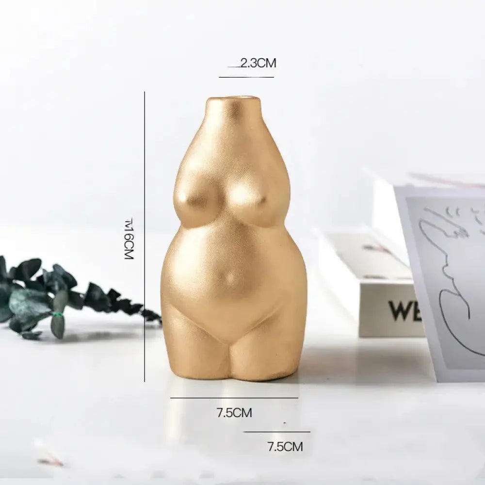 Golden smooth-surfaced ceramic vase shaped like a stylized female torso for modern minimalist decor