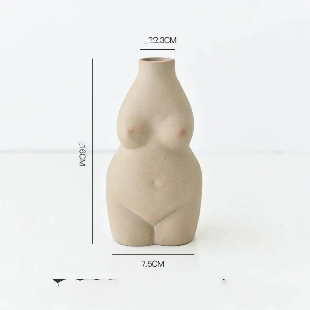 Beige ceramic vase shaped like a modern minimalist female form sculpture for decorative art display