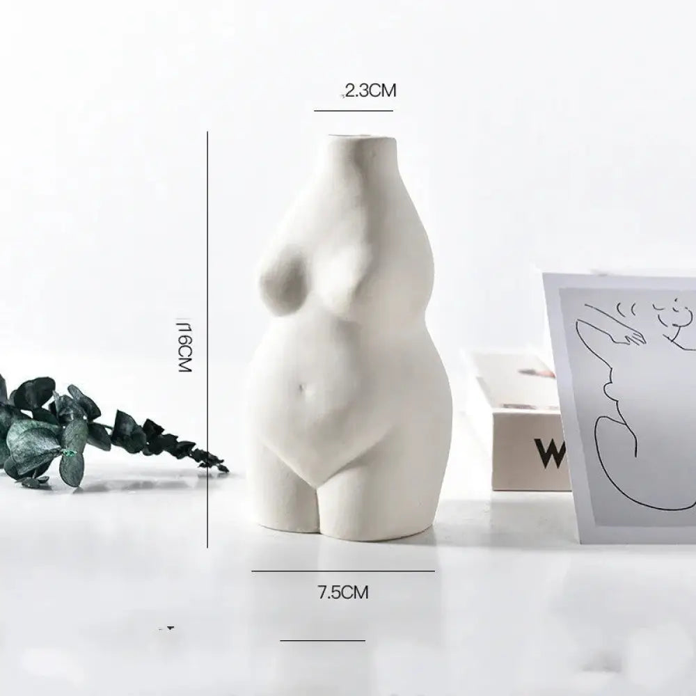 A minimalist white ceramic vase shaped like a stylized female torso for modern home decor