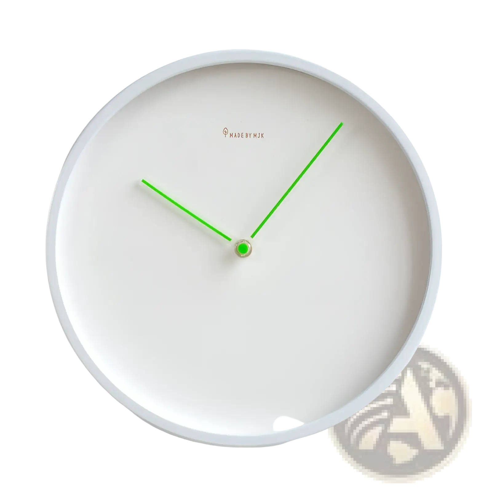 Modern minimalist metal wall clock with a white face green hands and a small gold center for living room use