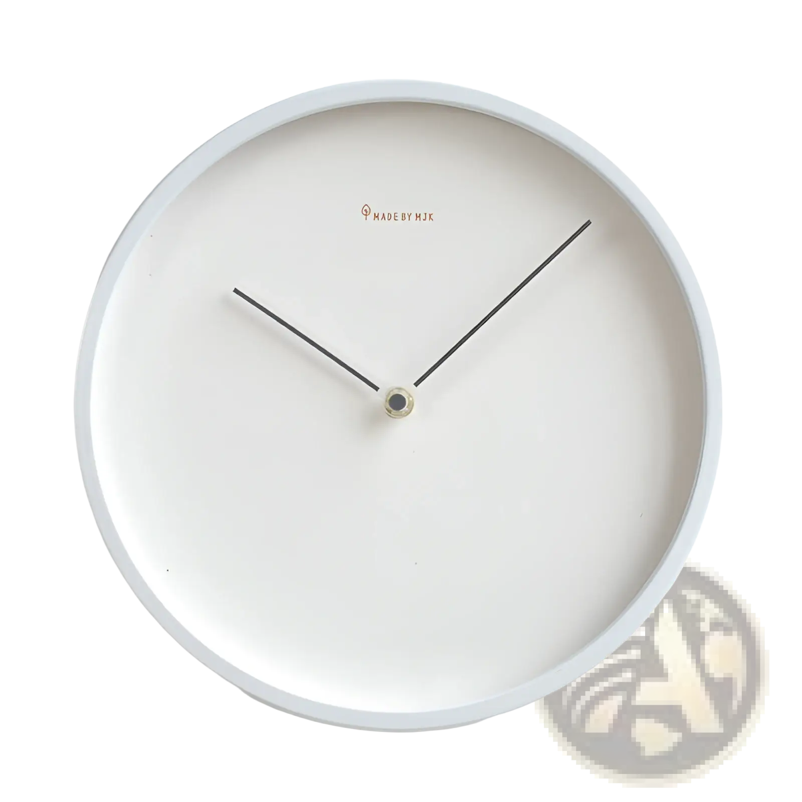 Modern minimalist metal wall clock with a white face slender black hands and made by mik logo for living room