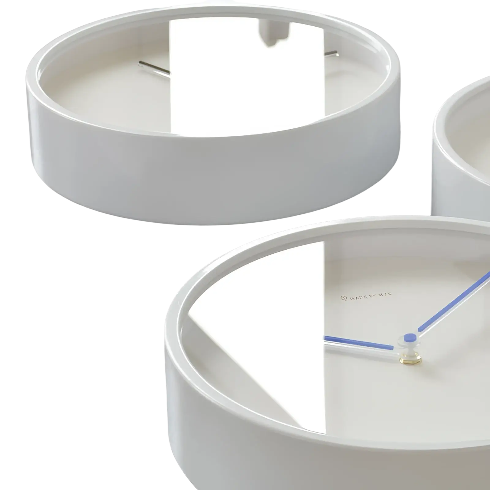 White circular metal wall clock with minimalist blue hands and mirrored face for modern living room decor