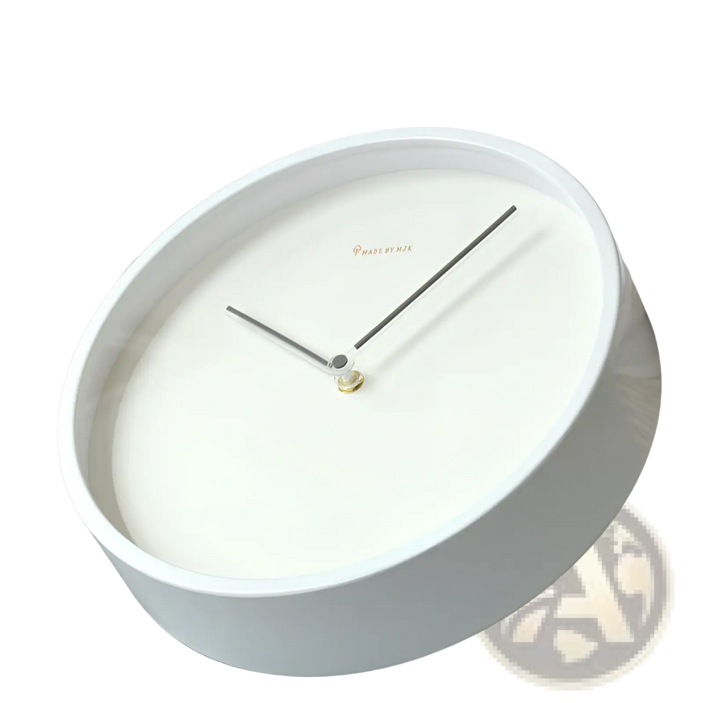 Modern minimalist metal wall clock with a white face and thin black hands for living room decor