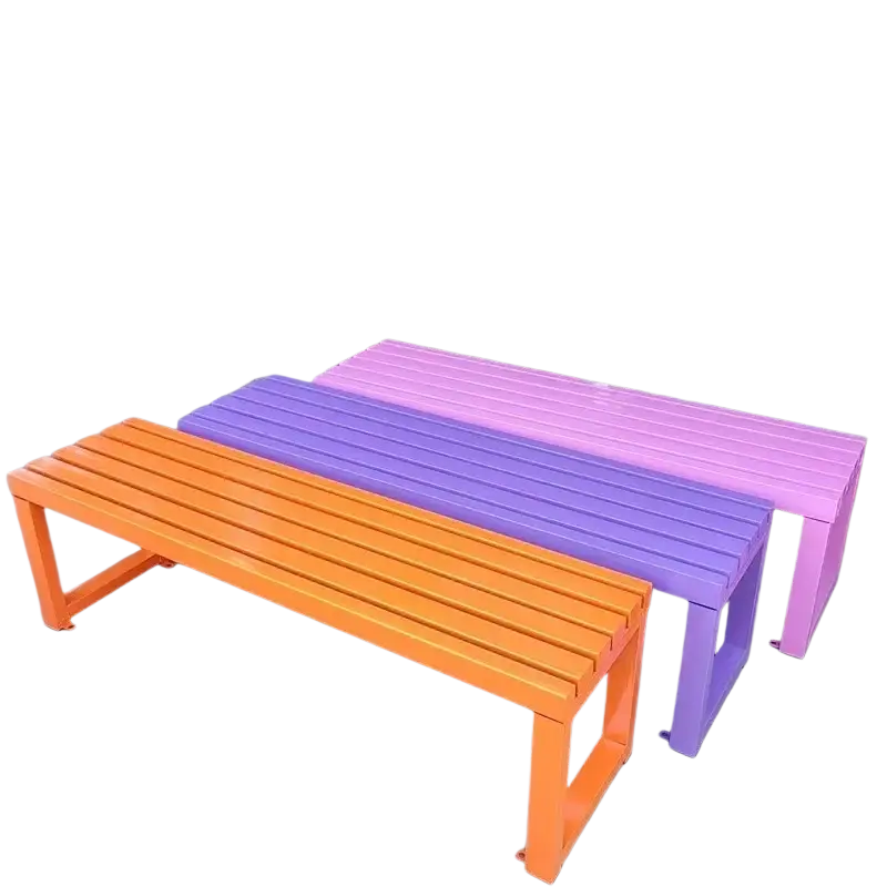 Three modern outdoor metal park benches with slatted seats painted in vibrant orange purple and pink