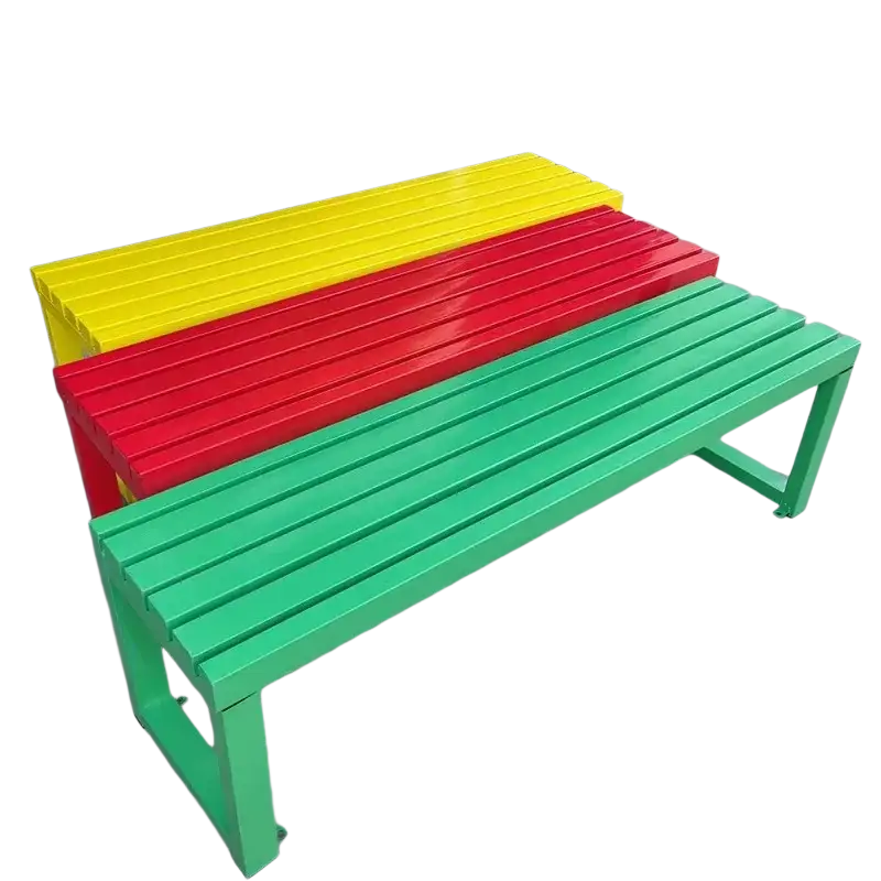 Modern outdoor metal park bench with vibrant glossy yellow red and green paint and slatted seating design