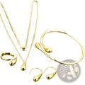 Modern silver teardrop jewelry set with gold-toned necklace bracelet ring and earrings featuring a sleek metallic finish