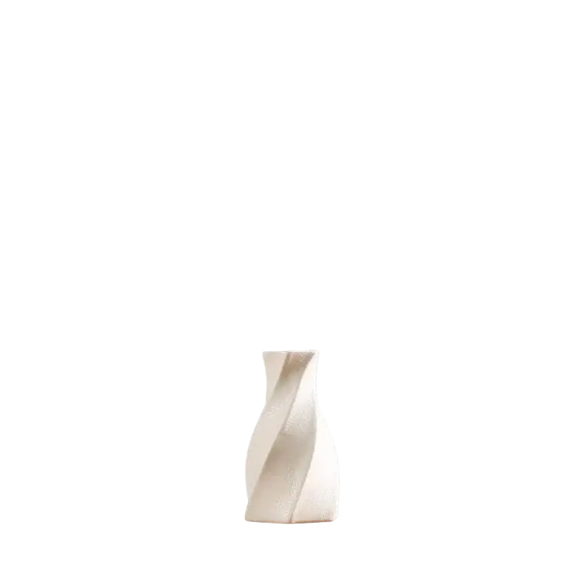 Modern white ceramic vase with a sleek twisted design and smooth surface for floral decor