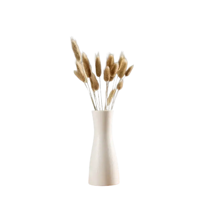 Modern white ceramic vase with flared top and tapered base holding dried golden bunny tail grass for floral decor