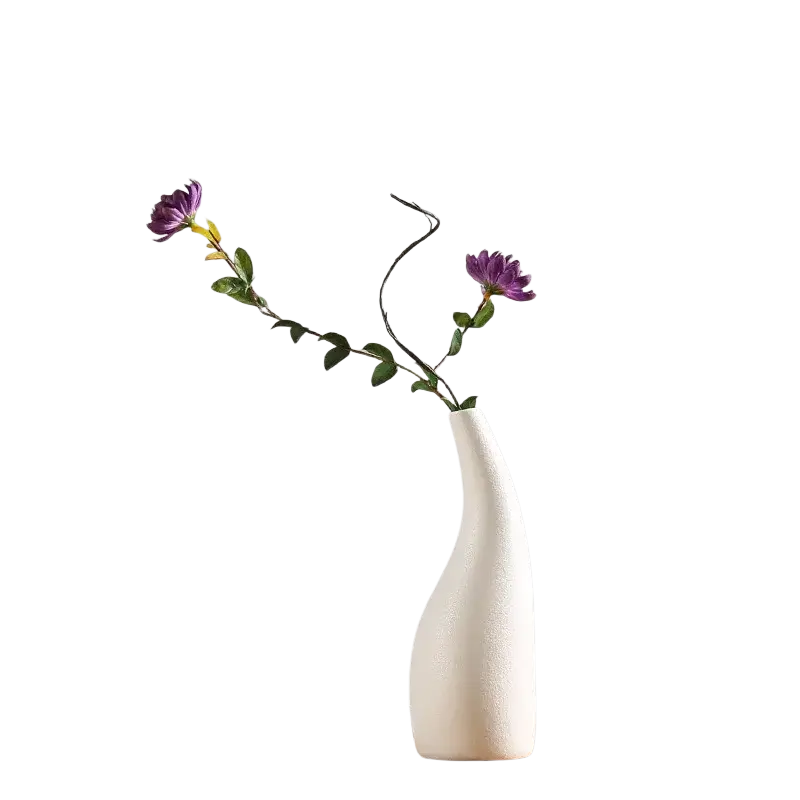 A sleek modern white ceramic vase with a smooth curved silhouette and subtle textured surface for floral decor