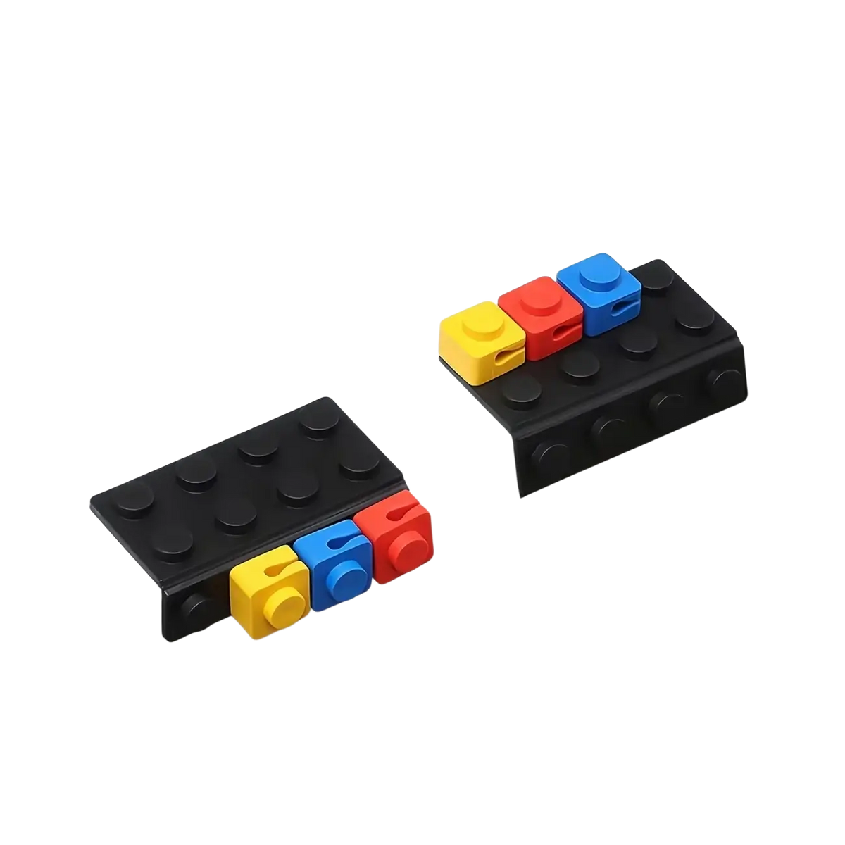 Black plastic lego-style table edge clips with yellow red and blue interlocking brick attachments modular brick cable organizer