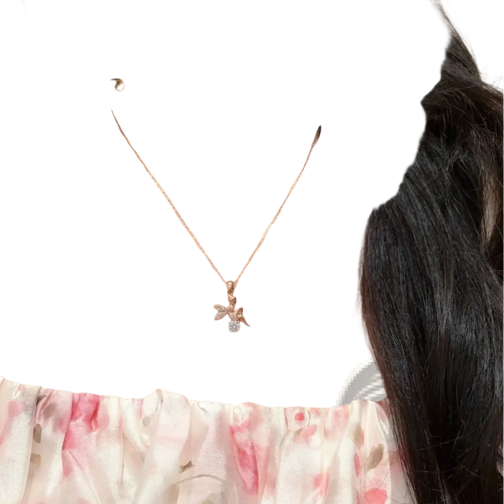 A delicate silver rose gold Moissanite elf necklace featuring a small bee pendant adorned with clear crystals