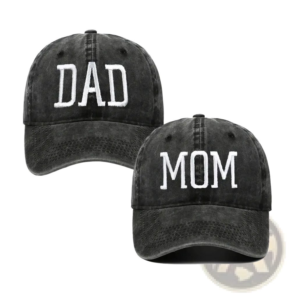 A pair of black distressed baseball caps embroidered with mom and dad in white lettering for casual wear