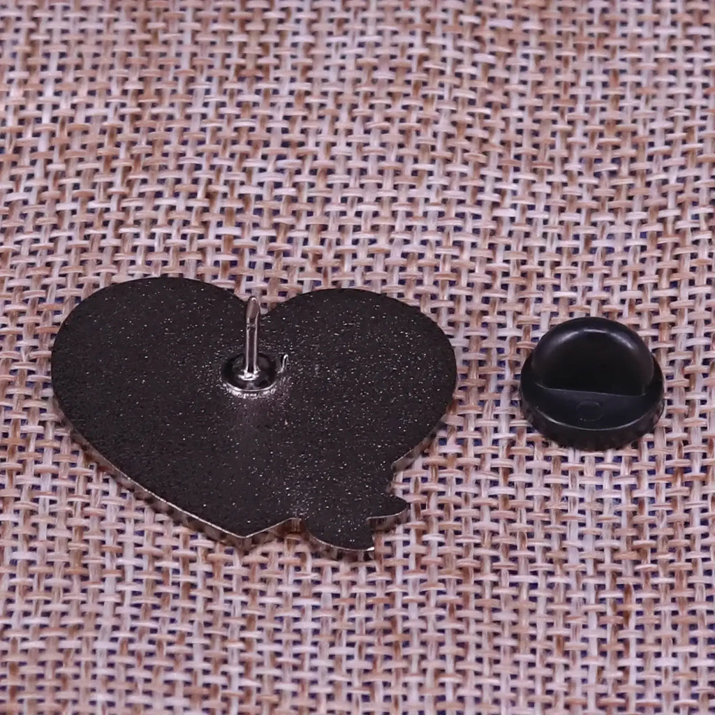 Black heart-shaped enamel pin with metallic clasp and black plastic back cover from mom is doing her best collection