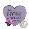 A silver heart-shaped enamel pin with pink roses and the inscription this mom is doing her best for mothers