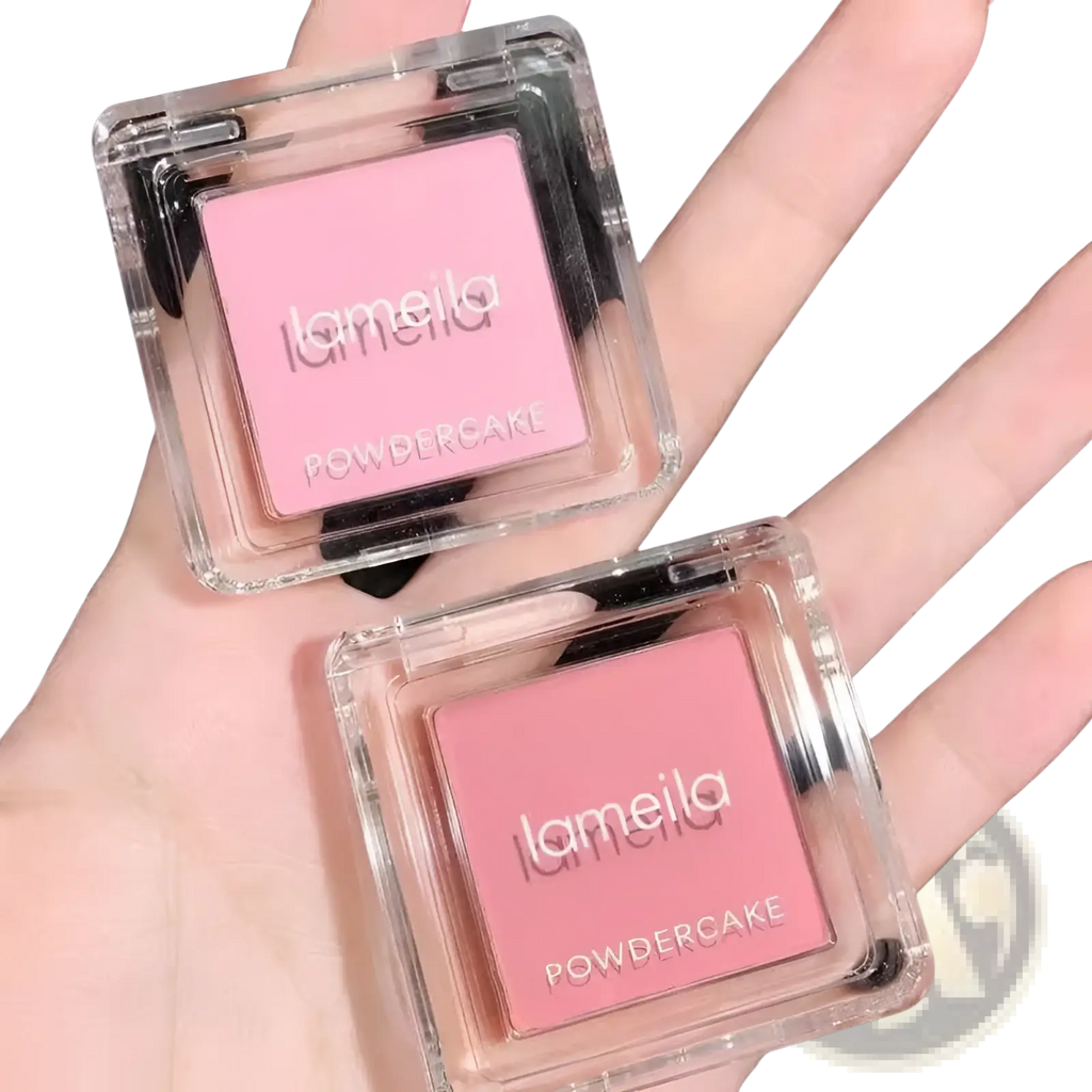 Two transparent square compact cases of lameila monochrome powder blush compact with pink powder cakes and brush