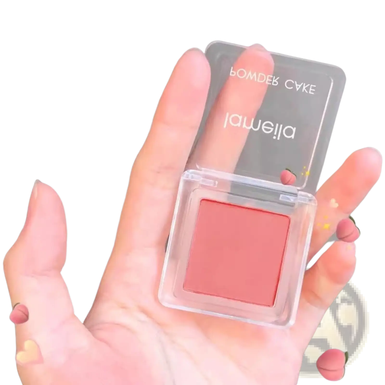 Monochrome powder blush compact with brush featuring a translucent square case and soft peachy-pink powder labeled jameilla
