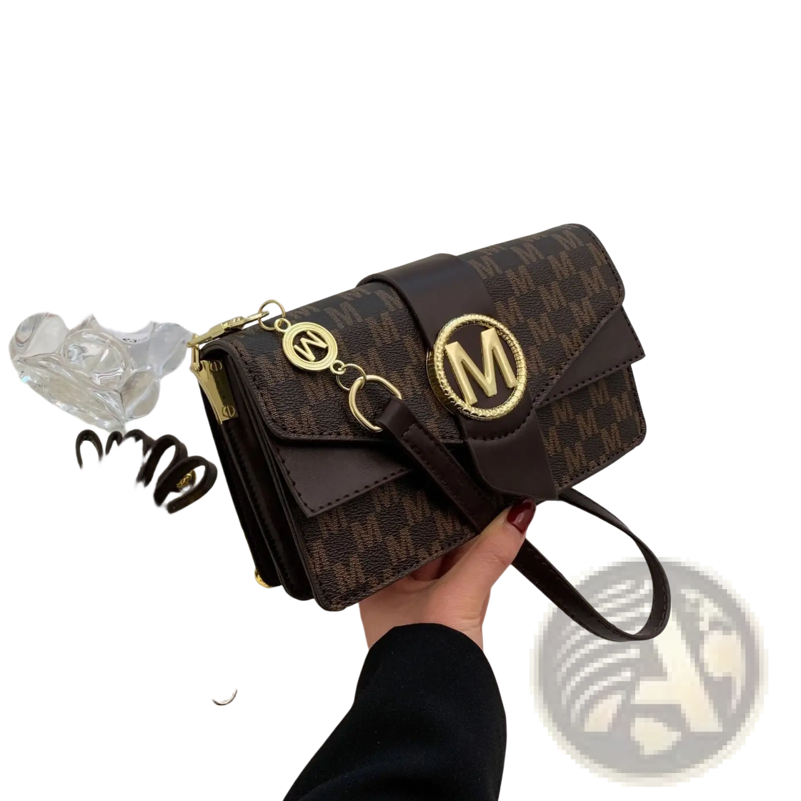 Brown and gold monogram letter print crossbody messenger bag with patterned design and circular m logo on front flap