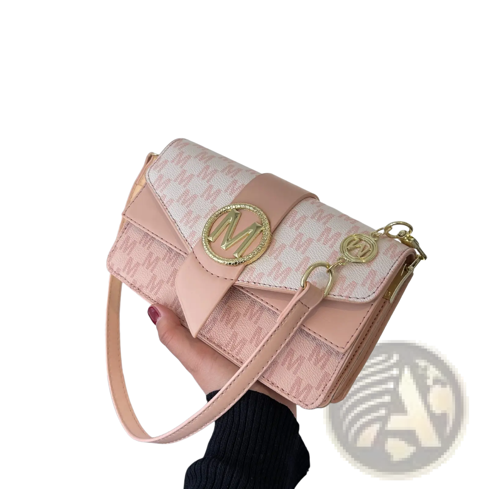 A blush pink monogram letter print crossbody messenger bag with repeating pattern and gold tone hardware