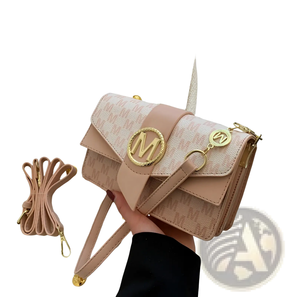 A blush pink monogram letter print crossbody messenger bag with gold-tone hardware and circular m logo on front flap
