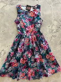 Moody floral 1950s vintage cotton midi dress with pockets featuring sleeveless fitted bodice and vibrant floral print