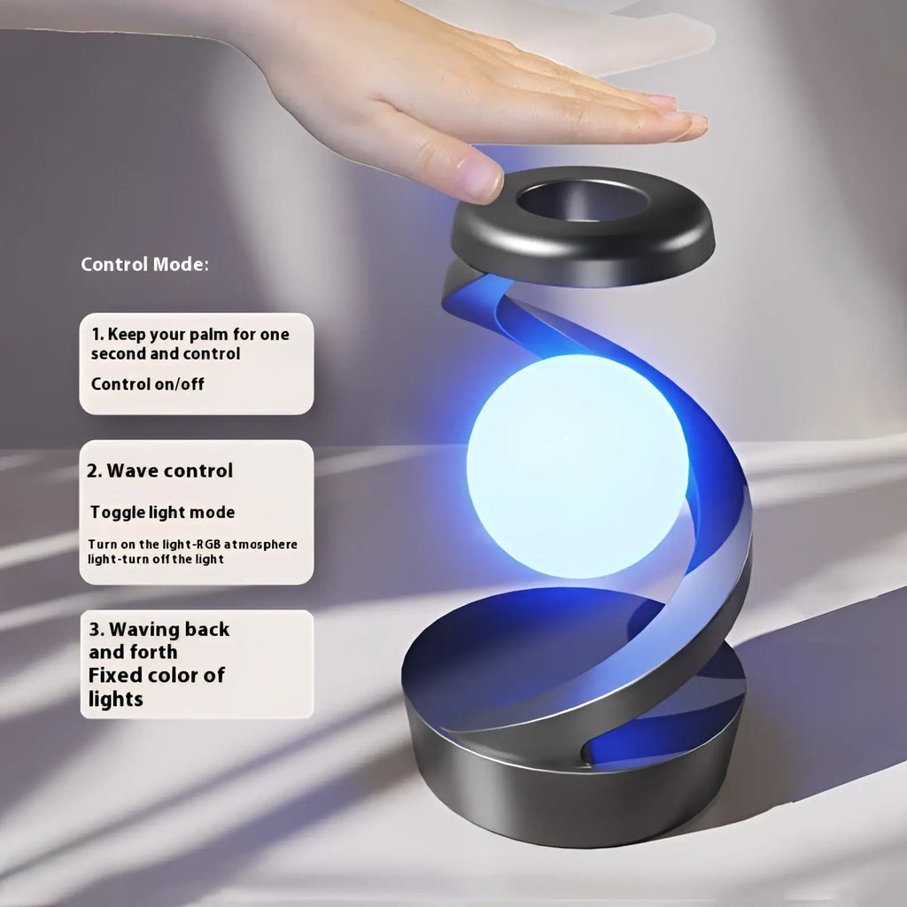 Moon desk lamp with wireless charging sensor control featuring a glowing blue sphere suspended in a metallic spiral
