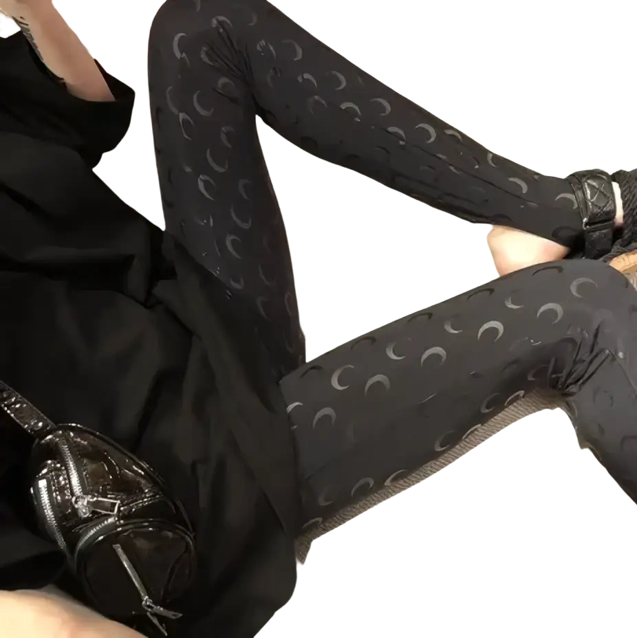 Black high waist leggings with a subtle silver crescent moon print perfect for casual or athletic wear