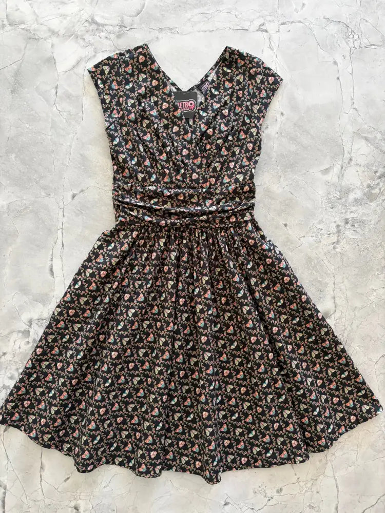 Moth Greta black floral cotton wrap dress with v-neckline gathered waist and small pink and white heart motifs