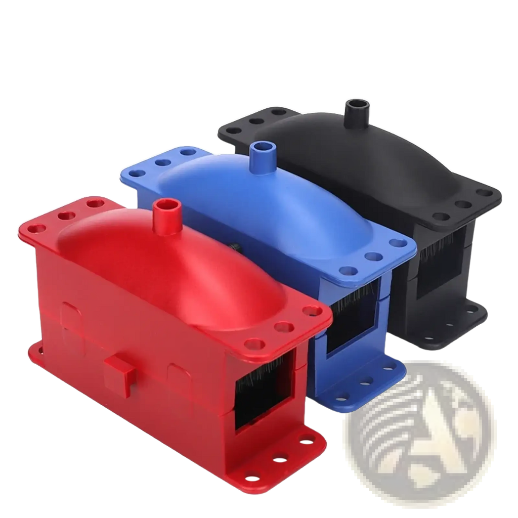 Motorcycle chain cleaner and lube kit with red blue and black plastic housing units featuring mounting holes and central protrusion