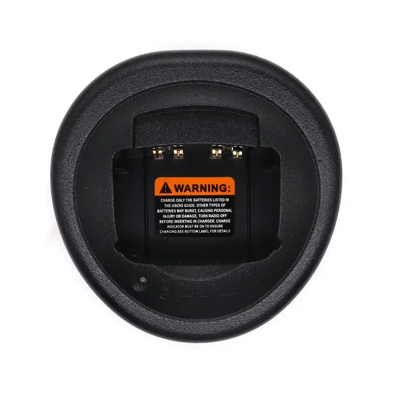 Black circular motorola walkie talkie desktop charger for gp328 ht750 with warning label and gold-colored contacts